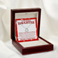 delicate heart necklace and message card displayed stananding up in led lit mahogany box